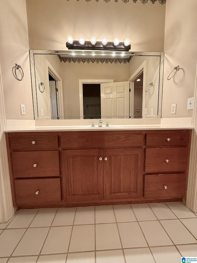 bathroom with tile patterned flooring and vanity