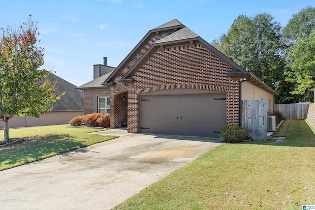 view of front facade featuring a front yard, a garage, and central air condition unit