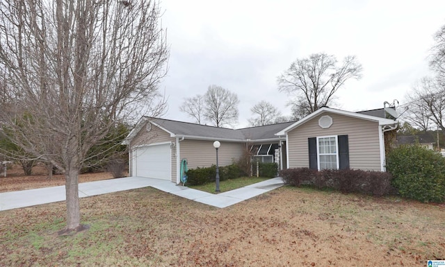 ranch-style house featuring a garage and a front yard