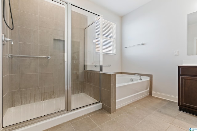 bathroom featuring tile patterned floors, vanity, and independent shower and bath