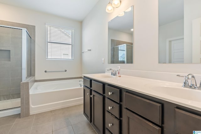 bathroom with tile patterned flooring, vanity, and separate shower and tub