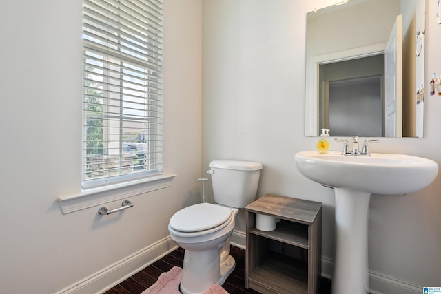 bathroom featuring sink and toilet