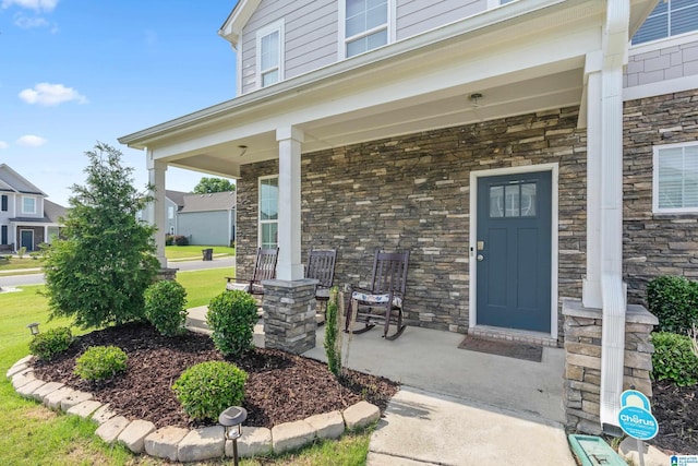 doorway to property featuring a porch