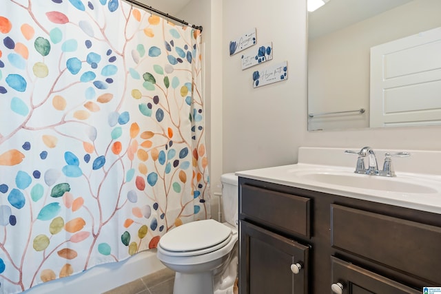 full bathroom featuring tile patterned flooring, shower / bath combo, vanity, and toilet