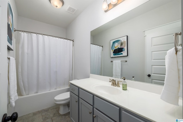 full bathroom featuring vanity, shower / bath combination with curtain, and toilet