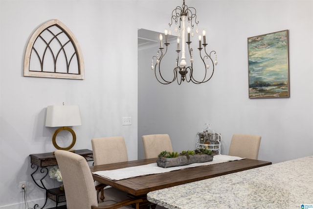 dining area with an inviting chandelier