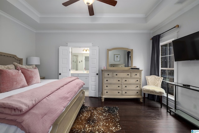 bedroom with a raised ceiling, ensuite bath, ceiling fan, and ornamental molding