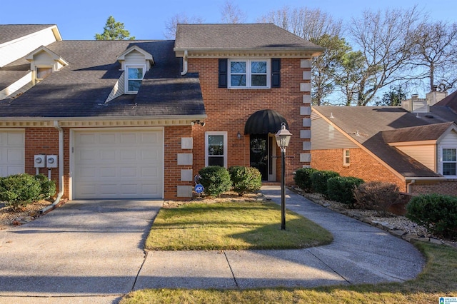 view of front facade with a garage and a front yard