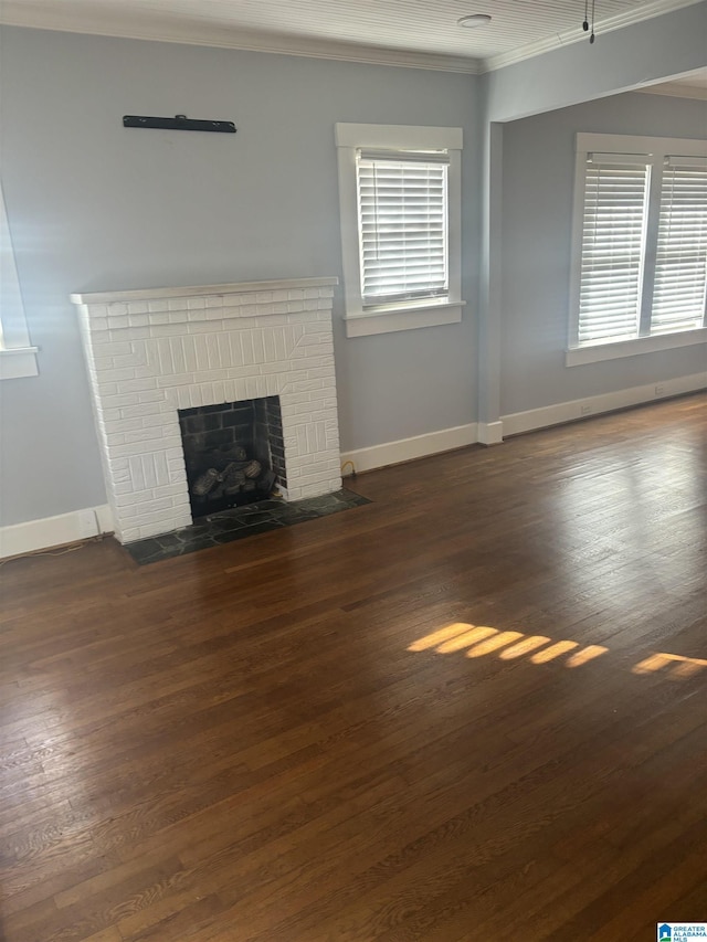 unfurnished living room with a fireplace, dark wood-type flooring, and ornamental molding