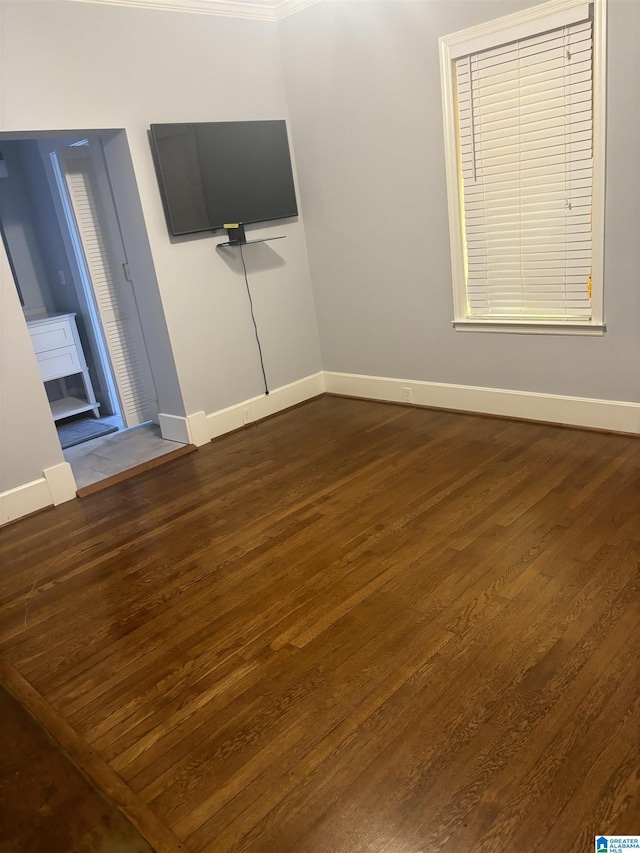 unfurnished living room with dark hardwood / wood-style flooring