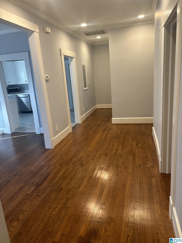 unfurnished room featuring dark hardwood / wood-style floors and ornamental molding