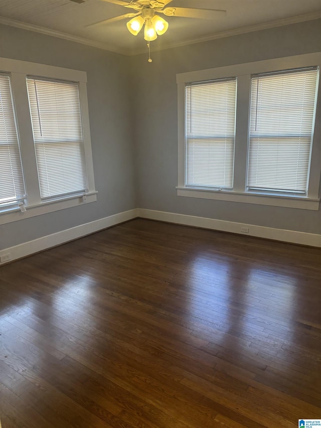 unfurnished room featuring ceiling fan, dark hardwood / wood-style flooring, and crown molding