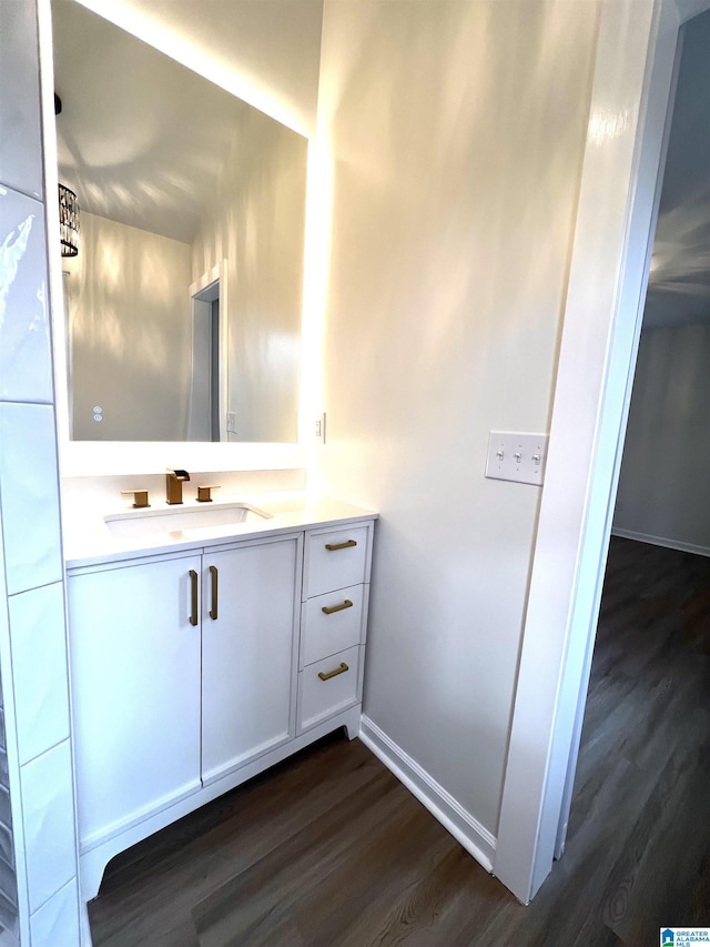 bathroom featuring vanity and hardwood / wood-style flooring