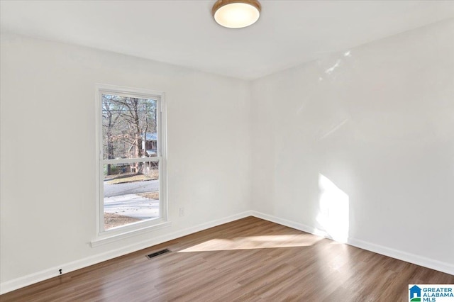 empty room featuring hardwood / wood-style flooring