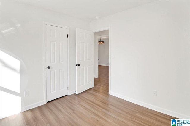 spare room featuring light hardwood / wood-style flooring