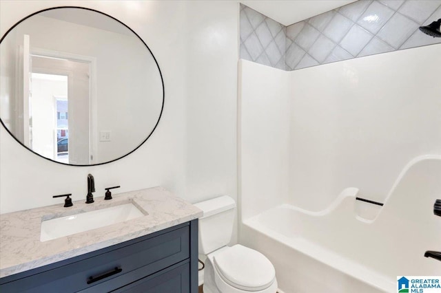 full bathroom featuring shower / bathing tub combination, vanity, and toilet