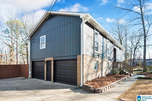 view of side of property with a garage