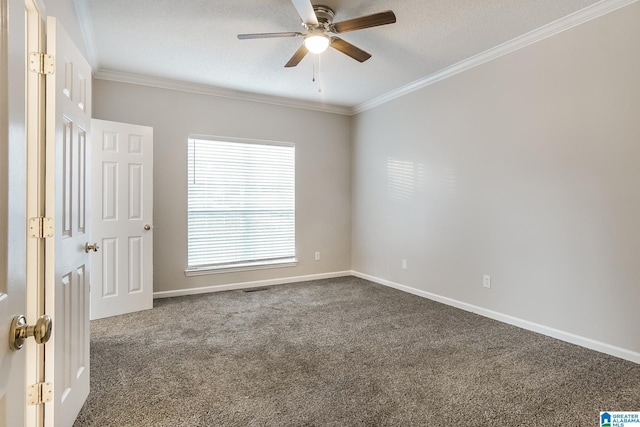 carpeted empty room with a textured ceiling, ceiling fan, and crown molding