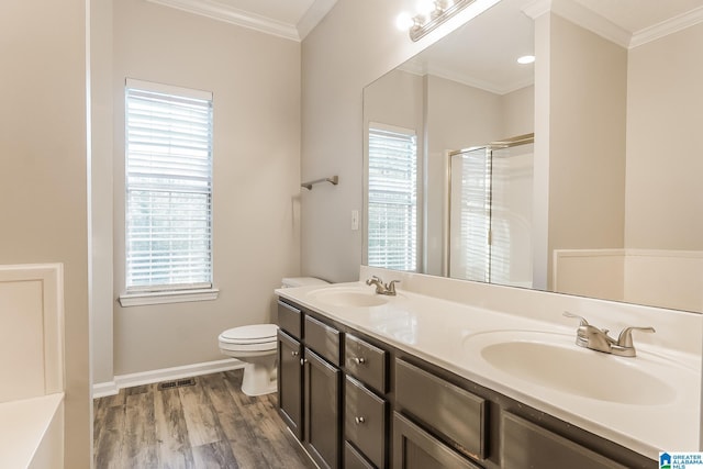 bathroom featuring hardwood / wood-style flooring, vanity, toilet, and ornamental molding