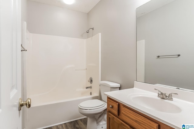 full bathroom with vanity, wood-type flooring,  shower combination, and toilet