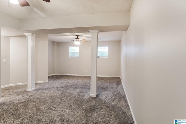 basement featuring carpet flooring and ceiling fan