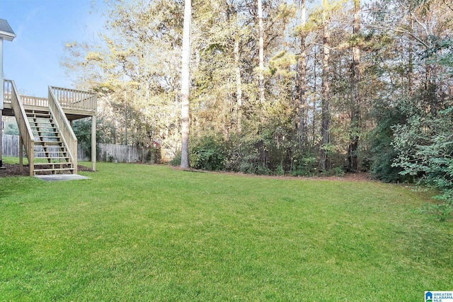 view of yard featuring a wooden deck