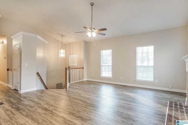 spare room with dark hardwood / wood-style floors and ceiling fan