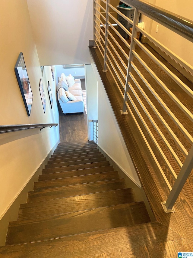 stairway featuring hardwood / wood-style floors