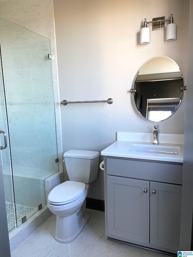 bathroom with tile patterned floors, vanity, toilet, and walk in shower