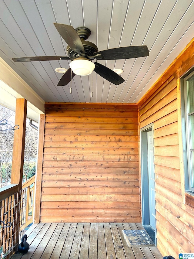 wooden terrace featuring ceiling fan