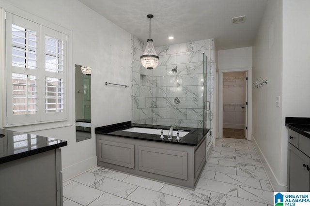 bathroom featuring separate shower and tub and vanity