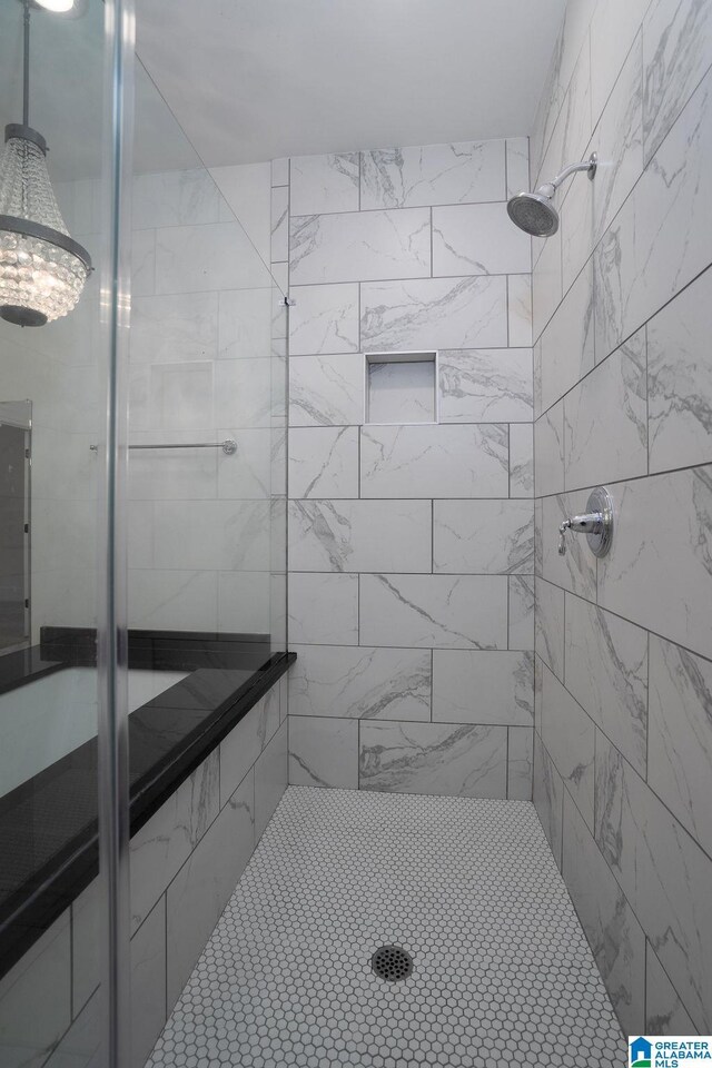 bathroom with a shower with shower door