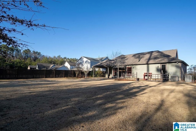 back of property featuring cooling unit