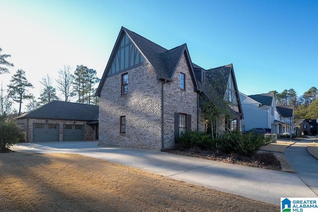 view of side of home with a garage