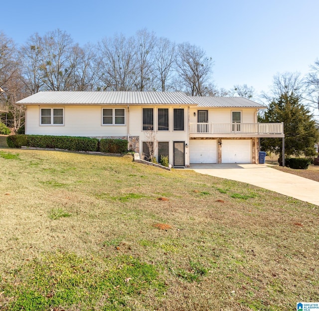 view of front of property with a garage and a front lawn