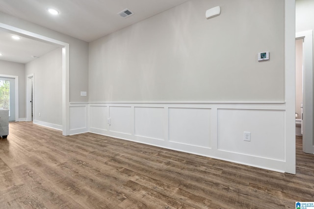 spare room with hardwood / wood-style floors