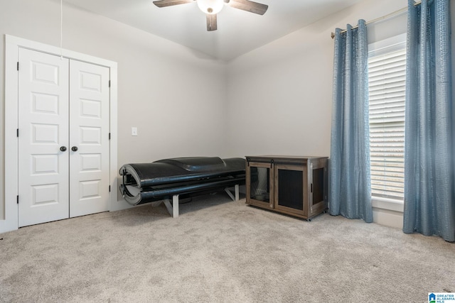 sitting room featuring ceiling fan and light colored carpet