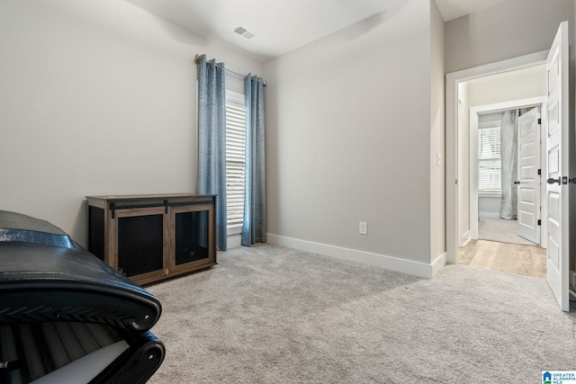 bedroom with light colored carpet