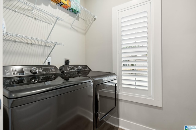 washroom featuring washing machine and clothes dryer