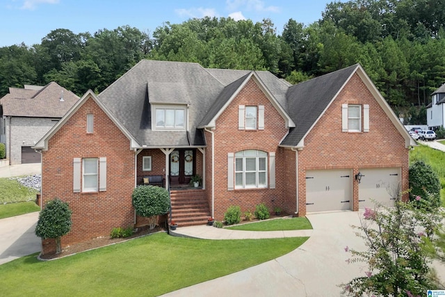 view of front of house with a front lawn and a garage