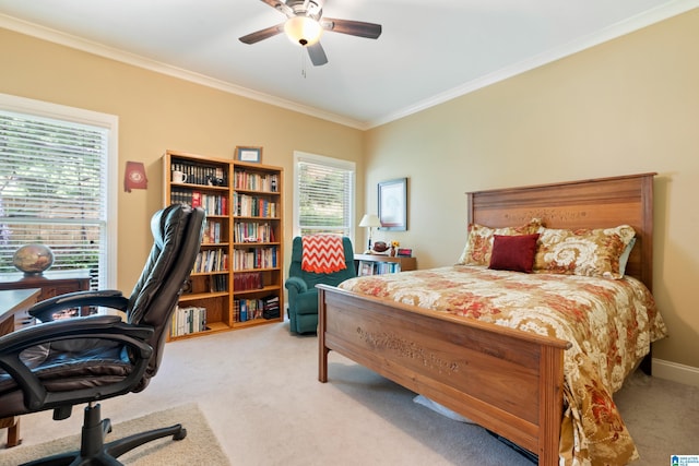 carpeted bedroom featuring ceiling fan and ornamental molding