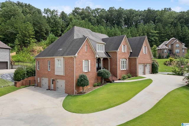 view of front facade with a front yard and a garage