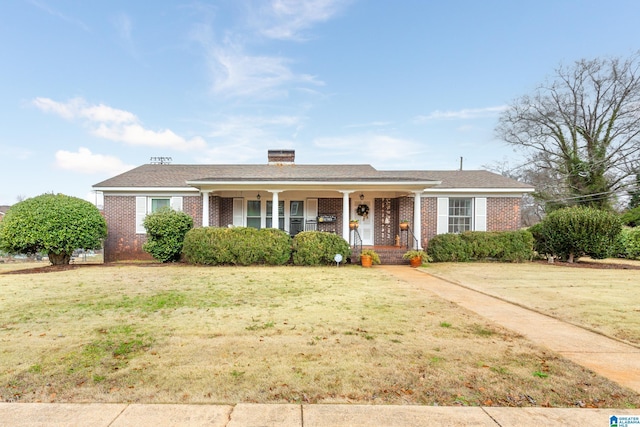 ranch-style house with a porch and a front lawn