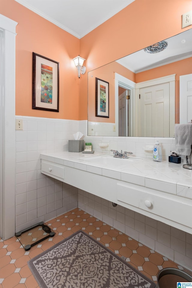 bathroom featuring tile patterned flooring, vanity, and crown molding