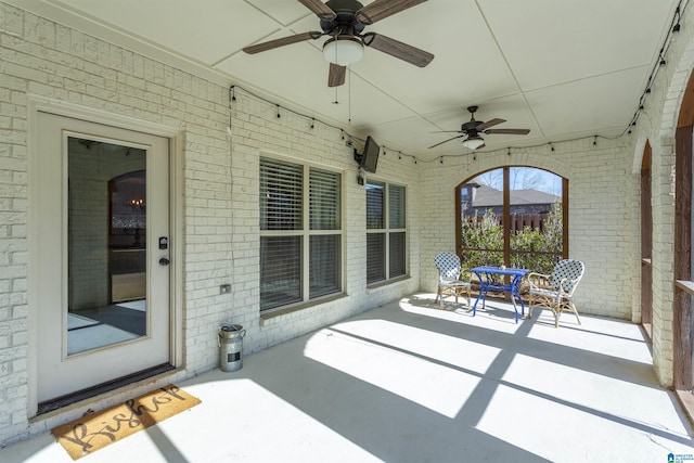 view of patio featuring ceiling fan