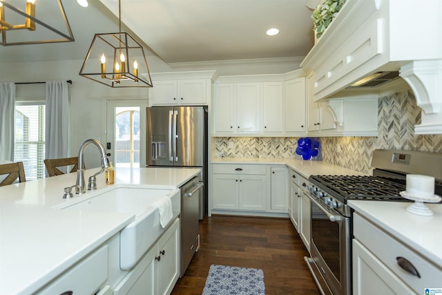 kitchen featuring white cabinets, decorative light fixtures, sink, and stainless steel appliances