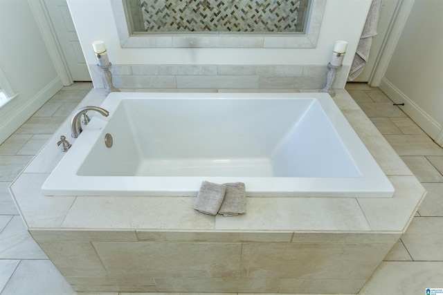 bathroom featuring a tub to relax in and tile patterned floors