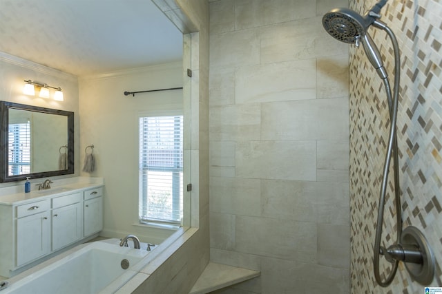 bathroom with vanity, ornamental molding, and a bath