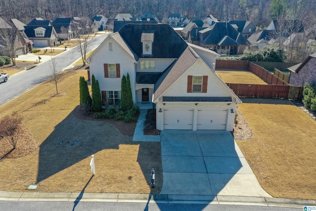 view of front facade featuring a garage and a front yard