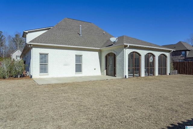 back of property with a patio